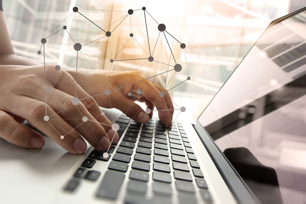 Double exposure of business man hand working on blank screen laptop computer on wooden desk as concept with social media diagram