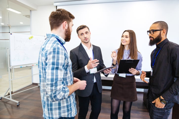 HR manager discussing predictability pay policies with employees