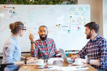 workplace behaviour, Colleagues engaging in a productive team meeting