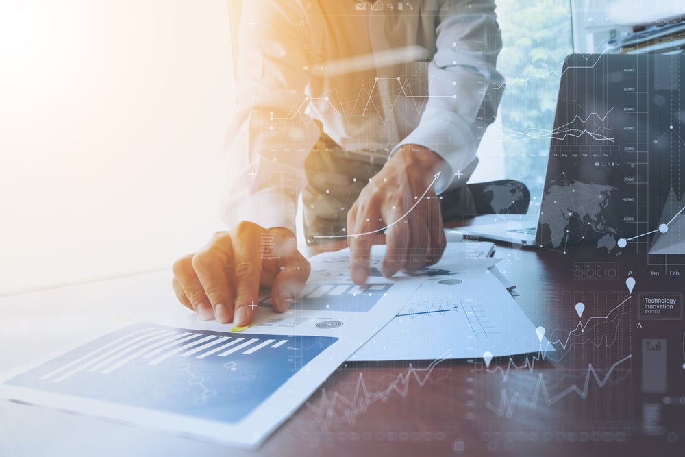 business documents on office table with smart phone and digital tablet and graph financial with social network diagram and man working in the background-3