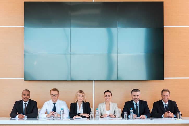 managers sitting in a panel interview