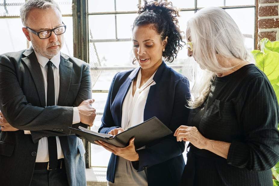 Team of employees discussing PTO policies in an office setting