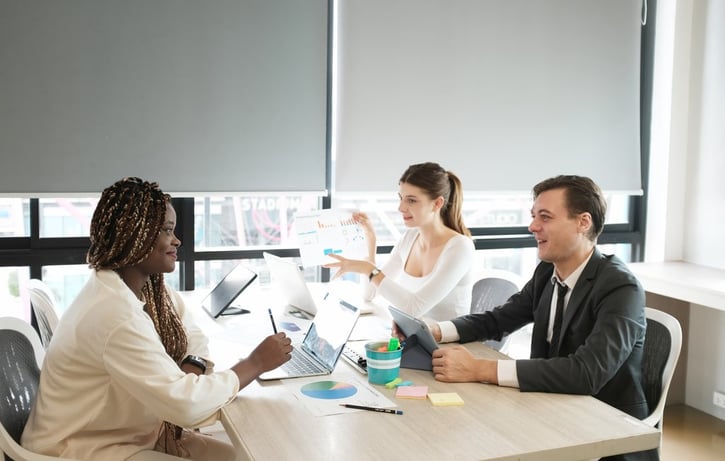 Executives in meeting room discussing rightsizing strategy 