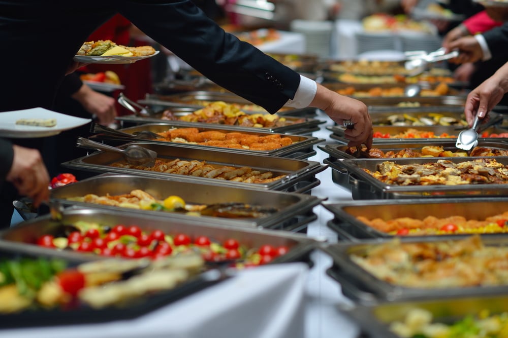 people group catering buffet food indoor in luxury restaurant with meat colorful fruits  and vegetables