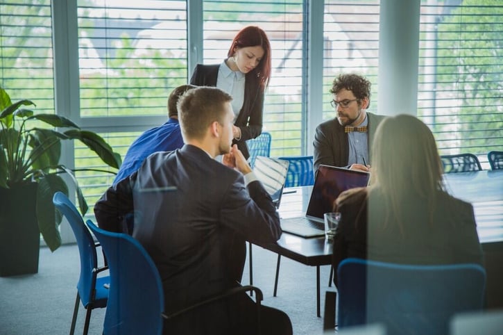 Employees discussing career lattice opportunities during a professional development session.